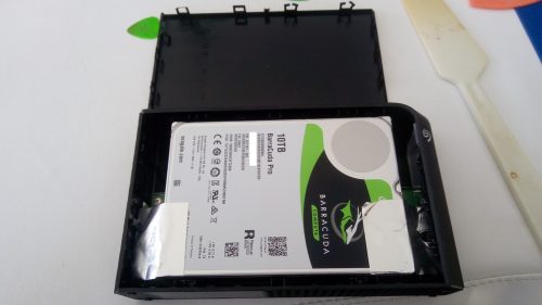 Shucking the Seagate Backup Plus 10TB - forcing open with plastic knife